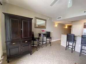 Kick back and relax in our open living area with balcony access and TV!