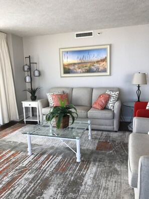 Family room.  New floors, paint and furniture.
