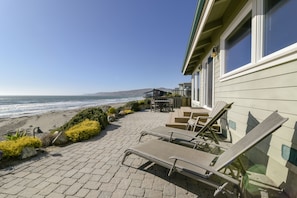 This beautiful home sits right on the beach with 180 degree views of the Pacific