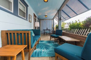 comfortable covered porch to enjoy seating for 6