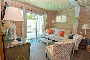 Living room with view of pool.  Sleeper sofa