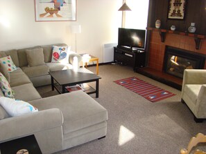 Living Room with gas fireplace and sectional sofa