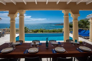 Covered outdoor dining table that sits 8 very comfortably.Breakfast with a view!