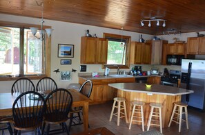 Kitchen and dining areas with plenty of seating