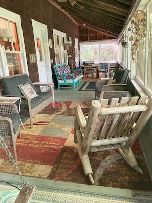 Room for the whole family on the porch. A great place to hang out if it rains.