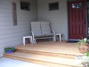 Front door with a small porch to sit awhile!