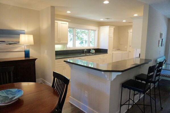 Renovated Greenslake Cottage with open kitchen, picture window  over golf course