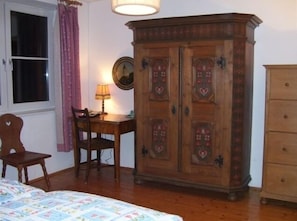 Bedroom #1 with traditional Austrian  furnishings, and mountain views.