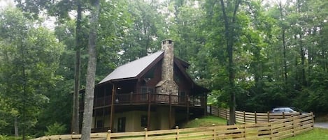 Cabin nestled in woods next to Big Brasstown Creek