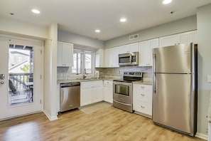 Remodeled, fully stocked kitchen with stainless steel appliances.