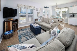 Living Room Area has a queen size commercial sleeper sofa, loveseat, and ottoman