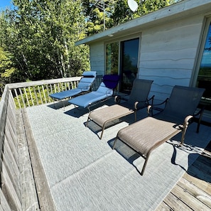 Relax with a good book on the lounge chairs on the spacious back deck.