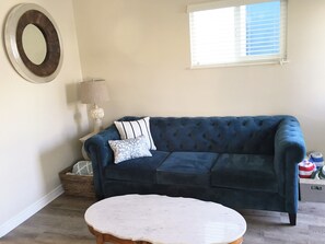 Sink into this comfortable couch. Great for watching TV, reading or needle point