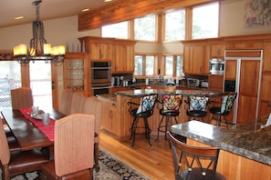 Kitchen and dining area with huge island and wet bar