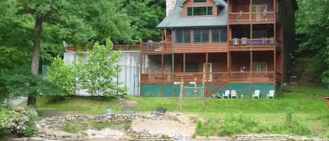 Our backyard with a basketball court, vollyball court,  fire pit and picnic area