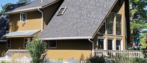 Side view of house from neighbor’s yard.