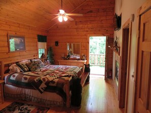 Master Suite with King bed, hi-def satellite TV, and private balcony