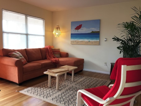 Spacious living room with flat sceen TV