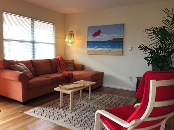 Spacious living room with flat sceen TV