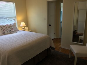 Bedroom facing East with queen size bed 