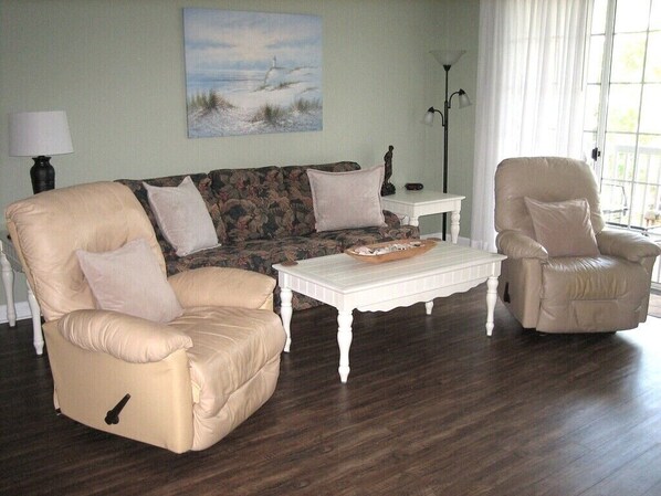 Comfortable leather recliners and a fold-out sofa-bed. 