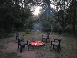 Fire Pit is between cabin and river