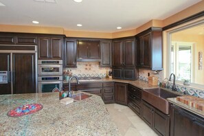 Goumet kitchen with large island - farm sink and prep sink