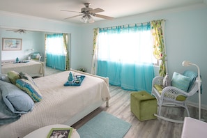 Master bedroom with new wood floor, looking at the veranda window.