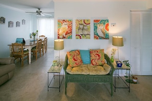 Photo of 'owl' seating area looking toward dining table and kitchen.
