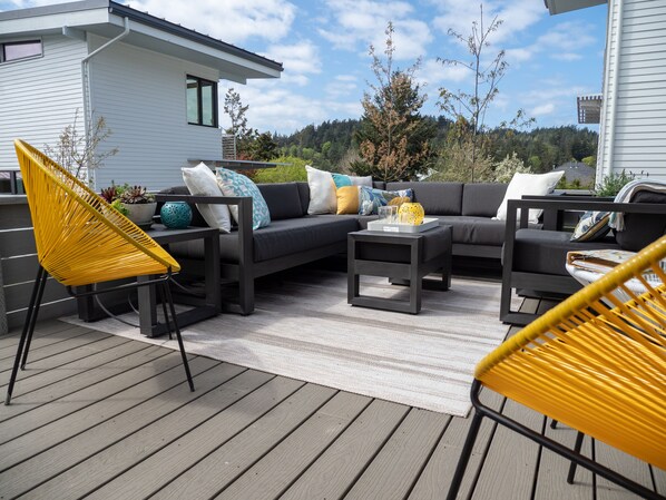 Welcome. Relax in the sun on the deck or curl up on a couch.  