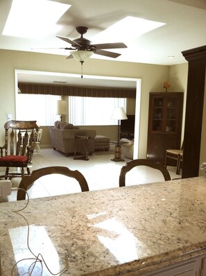 View from kitchen into living room and family room. 