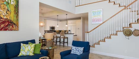 Designer Decorated Living Area with 20 ft Soaring Ceilings