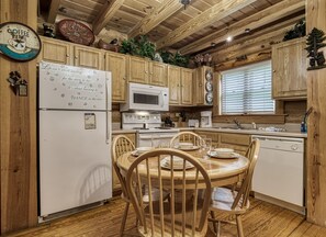 Smoky Mountain Cabin Rental - A Smoky Getaway - Dining area and fully furnished kitchen