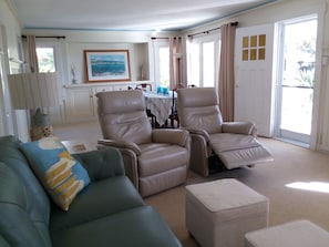 Large dining and living room combo with ocean views. Dining to seat 10