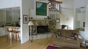 Open kitchen, living room and fireplace. 