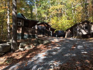 Sauna cottage on left, cabin in middle, workshop on right