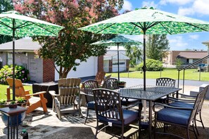Large outdoor patio, with seating for 10, fire pit, and gas grill.    Huge yard!