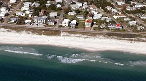 Aerial view of the townhouse (red star) steps from the beach