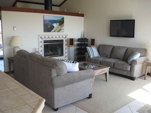 Living room with fireplace and new flat screen TV