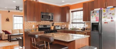 Kitchen with granite counter tops and stainless steel appliances