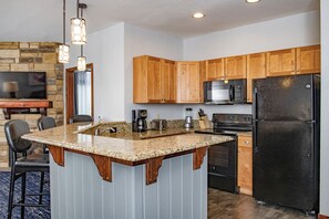 Modern Kitchen with Fireplace in Living Room
