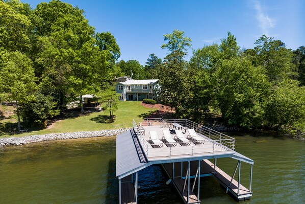 Aerial view from lake to back of house. 