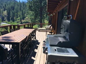 Nice big deck with views of river! Gas grill, table for 10, lounge chairs.