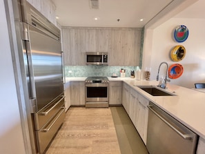 Newly remodeled kitchen with SubZero refrigerator and induction range.