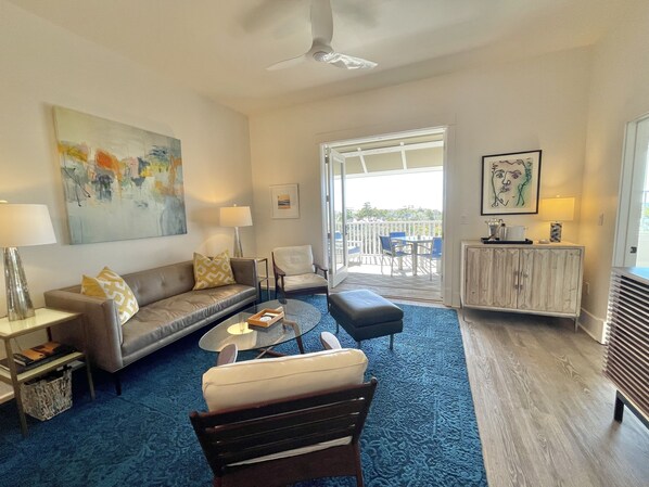 The living room flows out to a large balcony with Gulf of Mexico views.