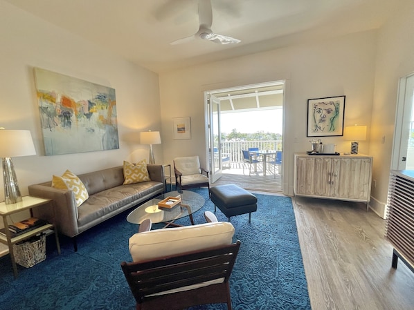 The living room flows out to a large balcony with Gulf of Mexico views.