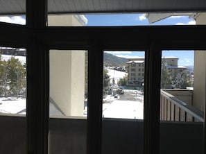 View of slopes/gondala area walk across street /put on skis/walk village