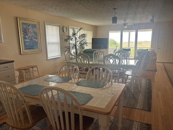 2025 Photo: Open Floor Plan from Kitchen to DR to LR with Oceanfront View