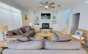 Enjoy resting in the spacious living room with an indoor fireplace during the winter. 
