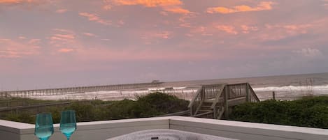 Oceanfront cocktail hour from your private hot tub